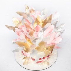 A wedding cake. Festive white cake with butterflies.