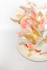 Fototapeta na wymiar A wedding cake. Festive white cake with butterflies.
