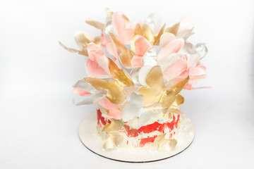Obraz na płótnie Canvas A wedding cake. Festive white cake with butterflies.