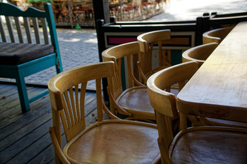 Fototapeta na wymiar Wooden Vintage chairs in cafe, modern cozy interior
