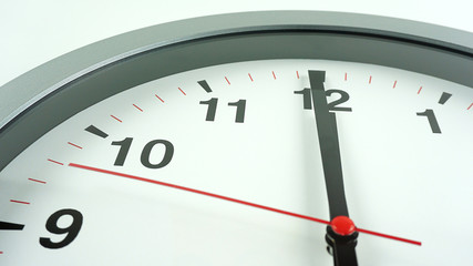 Close up Gray wall clock face beginning of time 12.00 on White background, Time concept..