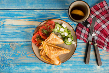 Sandwiches with cheese, tomatoes and cucumber.