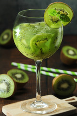 A glass with kiwi cocktail	