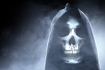 Human skull with a black cloak