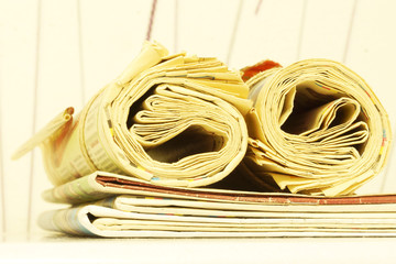 Newspapers Folded and Rolled. Stack of Business Magazines, Papers with News  