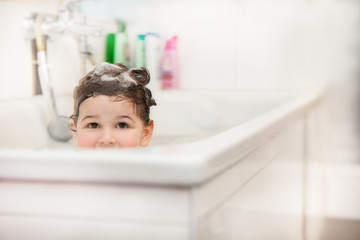 Child is taking a bath