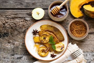 Thanksgiving concept. Roasted, baked pumpkin with apples, slices. Healthy food concept with copy space. Top view. Thanksgiving food. Halloween background. harvest season. Thanksgiving dinner.