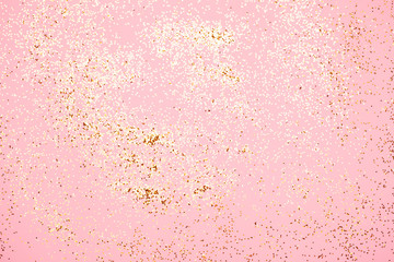 Pink confetti and stars and sparkles on pink background.