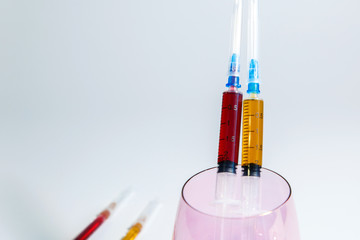 A set of medical syringes with color injections for cosmetology. The cocktail of the beautician for...