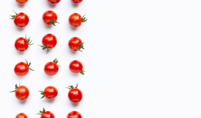 Fresh cherry tomatoes on white background.