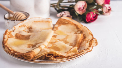 Pancakes with honey with copy space. Tasty breakfast concept