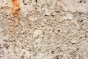 Texture of a concrete wall with cracks and scratches which can be used as a background