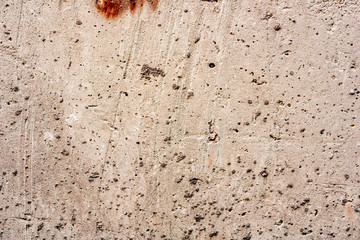 Texture of a concrete wall with cracks and scratches which can be used as a background