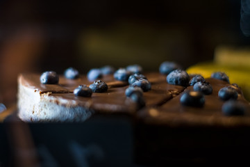 Homemade chocolate cheesecake with berries in the coffee shop. Sweets