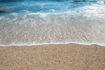 Wave of the sea on the sand beach