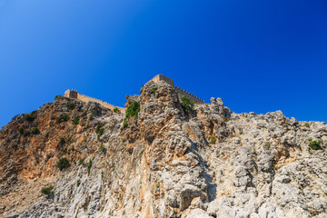 Fototapeta premium Rocks and the medieval fortress of Alanya, Turkey
