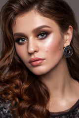 Fototapeta premium Beautiful elegant young woman with evening makeup and wavy hairstyle. Colorful eyeshadows