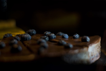 Homemade chocolate cheesecake with berries in the coffee shop. Sweets