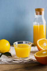 Obraz na płótnie Canvas Front view fresh and natural orange with lemon juice