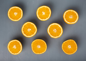 Aligned orange citrusses on table
