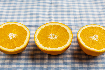 Close-up three aligned half cut oranges