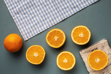 Top view oranges and towel on table
