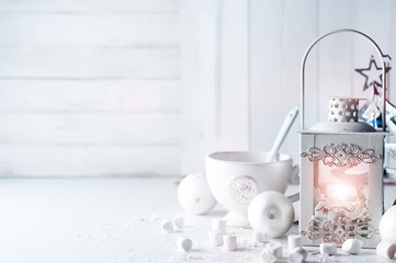 Burning lantern and christmas decoration on white background