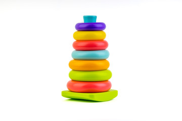 Plastic toy pyramid on a white background. Games and Copy space concept