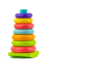 Plastic toy pyramid on a white background. Games and Copy space concept