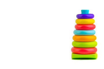 Plastic toy pyramid on a white background. Games and Copy space concept