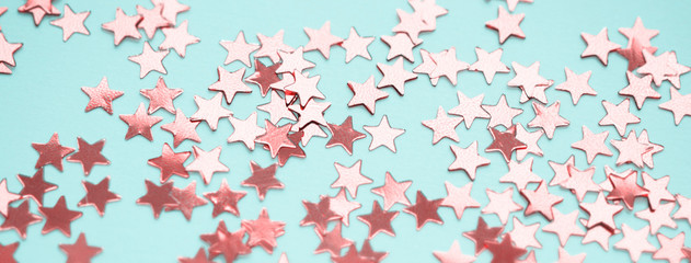 Golden stars glitter on blue background