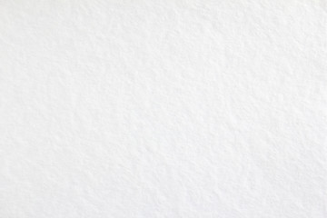 White blank sheet of drawing paper with rough surface texture background.