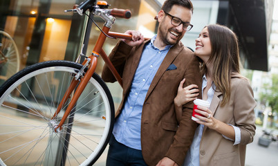 Happy smiling young couple having fun in the city