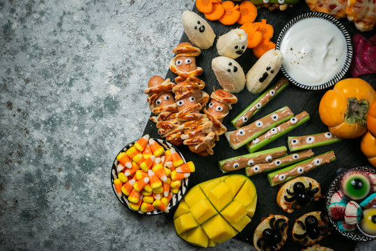 Halloween Party Food - Selection Of Halloween Style Appetizers On Rustic Background