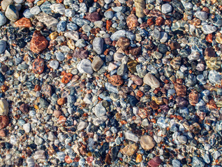 small multicolored stones under water