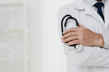 Doctor holding stethoscope with copy-space