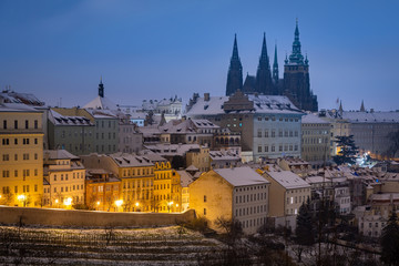 Fototapeta na wymiar Prague Castle at night during snowy winter