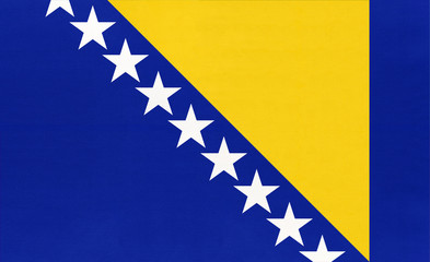 Bosnia and Herzegovina national fabric flag textile background.