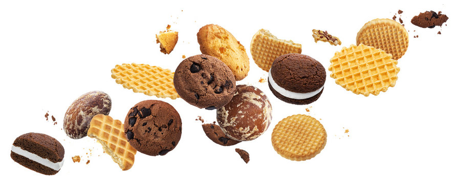 Falling cakes, cookies, crackers, waffles isolated on white background