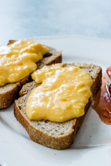 Scrambled Eggs with Bread Slice, Cheese and Jam / Marmalade.