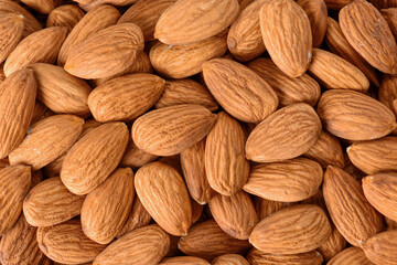 Almonds heap form top view. Pile of almonds. Beautiful almonds background.