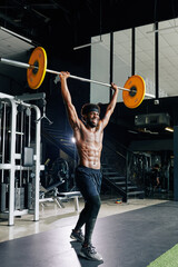 Excited happy Black muscular man practicing weight lifting in gym
