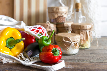 Vegetables and groceries in the kitchen. Storage in ecological friendly dishes, concept of zero waste and no plastic