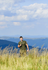 Fototapeta premium State border guard service. Protecting borders of motherland. Stop illegal immigrants. Guard the borders. Soldier with rifle. Man with weapon military clothes in field nature background. Army forces