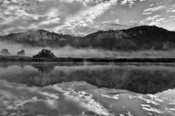 Fototapeta premium Reflection on the river at sunrise