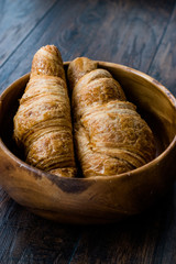 Freshly Baked Croissants in Wooden Bowl. Bakery Concept.