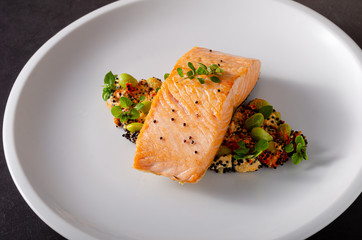 Grilled salmon with pepper hummus with quinoa