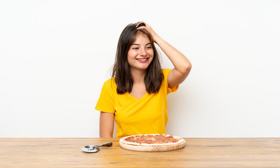 Caucasian girl with a pizza laughing