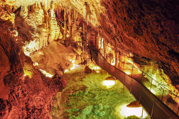 Caves in France. Grandes Canalettes in the French Pyrenees. Amazing view on stalactites in colorful...
