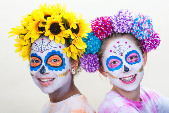 Two Teenage Girls in Dia de los Muertos Halloween Make Up